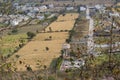 Agriculture Fields with Wheat Crop surrounding by residential construction Royalty Free Stock Photo