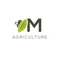 Agriculture logo letter M. Tractor icon. Green food emblem