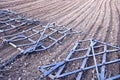 Agriculture machinery harrow rake on plowed field