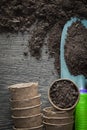 Agriculture peat pots soil shovel on wooden board