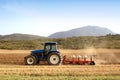 Agriculture plowing tractor on wheat cereal fields