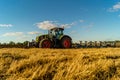 Agriculture plowing tractor on wheat cereal fields