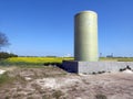 Fertilizer vessel with rapeseed fields and industry behind