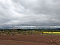 Agriculture in Scotland - freshly plowed field and rapeseed field in background - spring in Scotland