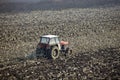 Agriculture tractor cultivated land Royalty Free Stock Photo