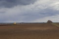 Agriculture.The tractor prepares the field for sowing wheat in Royalty Free Stock Photo