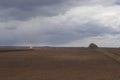 Agriculture.The tractor prepares the field for sowing wheat in Royalty Free Stock Photo