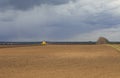 Agriculture.The tractor prepares the field for sowing wheat in Royalty Free Stock Photo