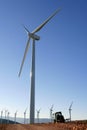 Agriculture tractor under electric wind mills