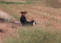 Agriculturist male use the loincloth on the floor for relax sitting and wear the hat nature