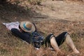 Agriculturist male use the loincloth on the floor for relax sleeping with hat close the face on nature