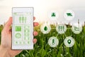 Agritech concept smartphone app with graphic display agricultural icons Royalty Free Stock Photo