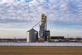 Agro silos granary elevator. Silos on agro-processing manufacturing plant for processing drying cleaning and storage of Royalty Free Stock Photo