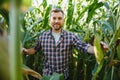 Agronomist checking corn if ready for harvest. Portrait of farmer Royalty Free Stock Photo