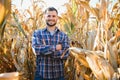 Agronomist checking corn if ready for harvest. Portrait of farmer. Royalty Free Stock Photo