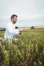 Agronomist checking the crops in the field