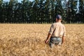Agronomist farmer waiting for harvest in wheat field Royalty Free Stock Photo