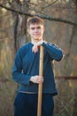 Agronomist handsome strong man with shovel on background of flo Royalty Free Stock Photo