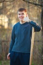 Agronomist handsome strong man with shovel on background of flo Royalty Free Stock Photo