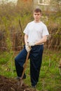 Agronomist handsome strong man with shovel on  background of flower beds Royalty Free Stock Photo