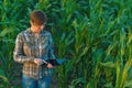 Agronomist with tablet computer in corn field