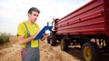 Agronomist at Work During Wheat Harvest Royalty Free Stock Photo