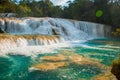Agua Azul, Chiapas, Palenque, Mexico. Landscape on a magnificent waterfall with a turquoise pool surrounded by green trees. Royalty Free Stock Photo