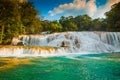 Agua Azul, Chiapas, Palenque, Mexico. View of the amazing waterfall with turquoise pool surrounded by green trees. Royalty Free Stock Photo