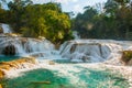 Agua Azul, Chiapas, Palenque, Mexico. View of the amazing waterfall with turquoise pool surrounded by green trees. Royalty Free Stock Photo