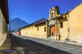 Agua volcano & cobblestone street, Antigua, Guatemala Royalty Free Stock Photo