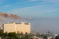 AGUADULCE, SPAIN - 12 DECEMBER 2023 Panorama of dense fog that covered many buildings and the sea landscape in a small seaside