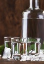 Aguardiente - traditional Spanish strong alcoholic drink, grape moonshine or vodka, in glasses on an old wooden table, place for Royalty Free Stock Photo