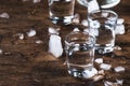 Aguardiente - traditional Spanish strong alcoholic drink, grape moonshine or vodka, in glasses on an old wooden table, place for Royalty Free Stock Photo