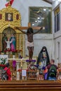 Black Jesus in the Virgin Del Carmen Spanish church in Aguas Calientes town square in Peru.