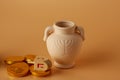 Ah gelt or money or coins with Hanukkah dreidel and a Hanukkah clay jug . Translation: Happy Holidays Royalty Free Stock Photo