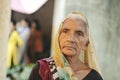 Ahemdabad, Gujarat, India - 20th june, 2019: Old Indian village woman wearing saree looks at the camera with no expressions on her