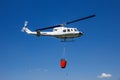 Helicopter bambi bucket aerial fire fighting Royalty Free Stock Photo