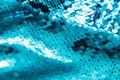 AI aqua blue trendy color of year 2021 sequin fabric texture. Shiny sparkling background. Clothing piece of glitter