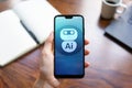 AI Artificial intelligence Deep machine learning concept. Robot icon on mobile phone screen. Royalty Free Stock Photo