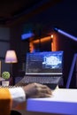 AI expert writes code on laptop in apartment office, close up Royalty Free Stock Photo