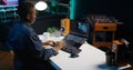 AI expert writes code on laptop in apartment office Royalty Free Stock Photo