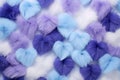 fluffy, puffy and oddly heart made of faux fur purple-blue isolated on a soft grey background Royalty Free Stock Photo