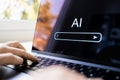 AI generate content with prompt in laptop. Text or image generator at work using computer. Search with artificial intelligence. Royalty Free Stock Photo