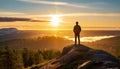 A man on the top of a hill feeling hope, strength, and motivation