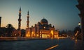 A mosque with two minarets is shown at night. Royalty Free Stock Photo