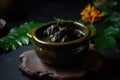 AI generated appetizing Dinuguan in a dark green bowl