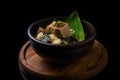 AI generated appetizing TokwaÃ¢â¬â¢t baboy in a dark green bowl