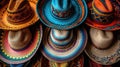 An array of Mexican sombreros featuring rich colors and patterns on display. Royalty Free Stock Photo
