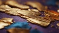 A blurry image of a gold and orange surface with a blue and purple background. Royalty Free Stock Photo