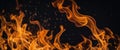 A bunch of fire flames on a black background. Royalty Free Stock Photo